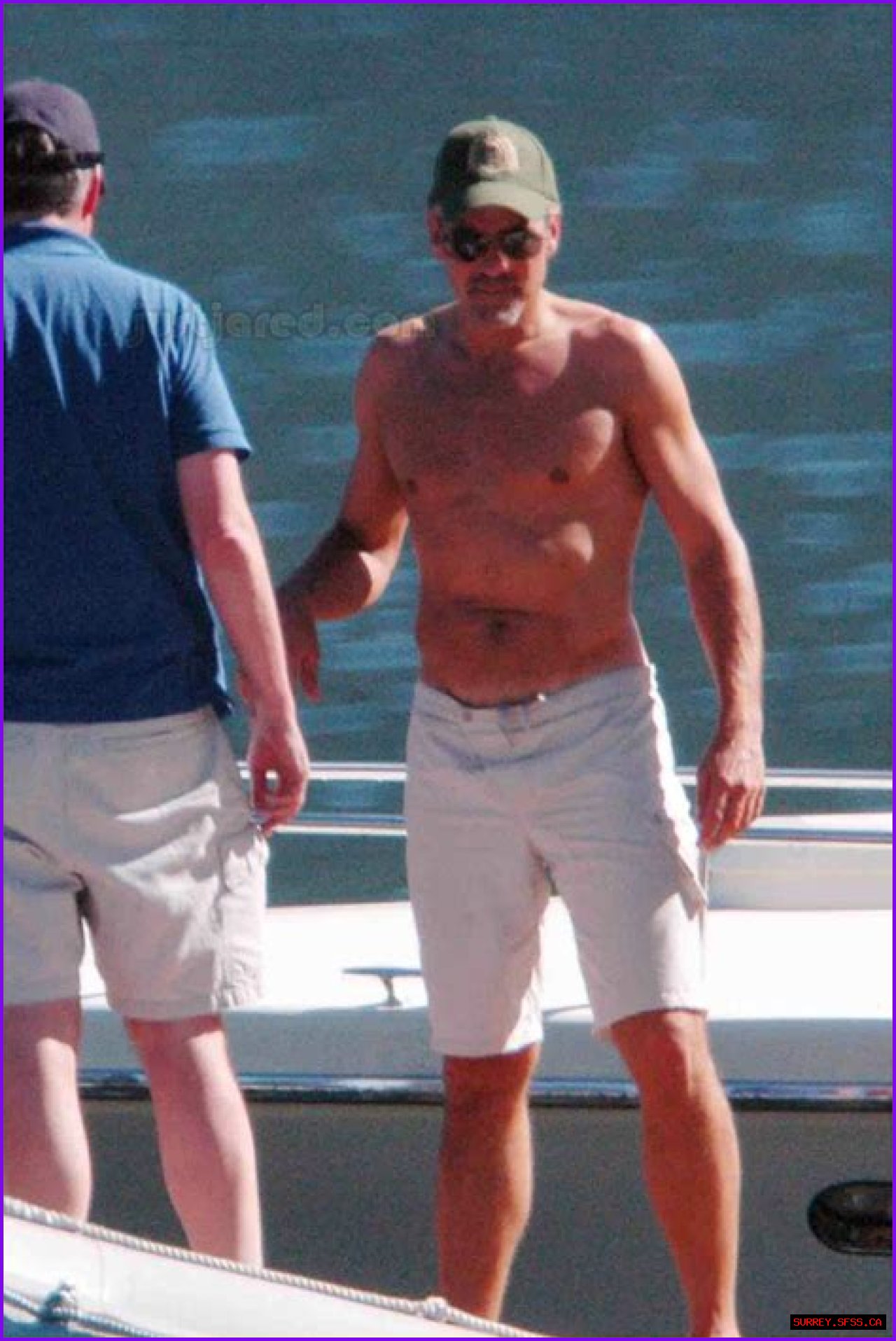 George Clooney shirtless out on his boat